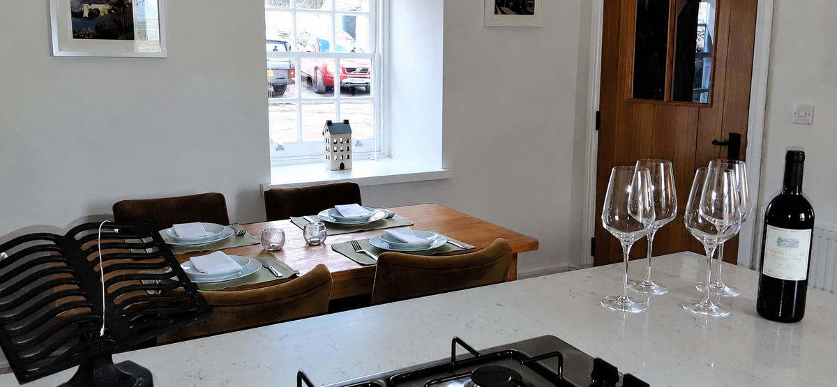 Open-plan kitchen and dining area at The Coach House holiday cottage in Alston